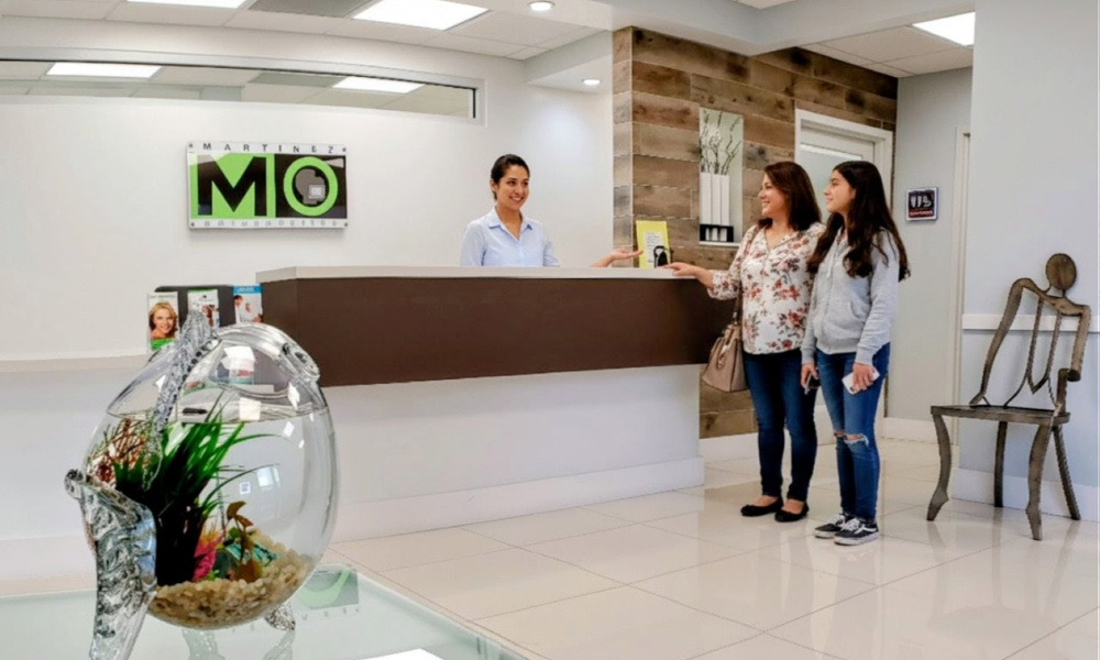 Modern orthodontic reception area at Martinez Orthodontics in Miami.